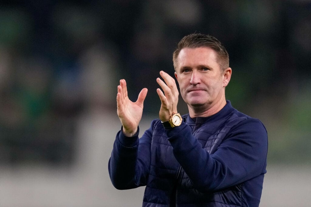 Robbie Keane applauds after a game.