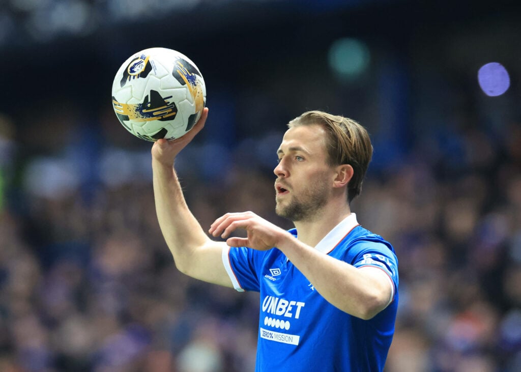 Rangers defender Tuur Rommens prepares to take a throw in at Ibrox.