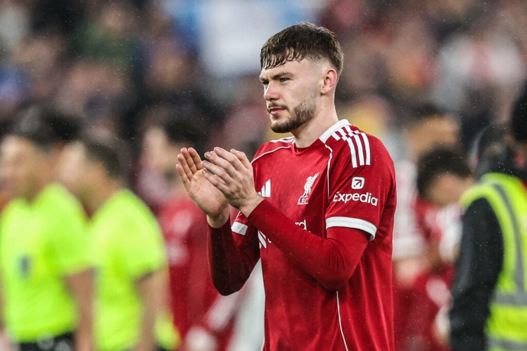 Liverpool defender Conor Bradley applauds after a game.