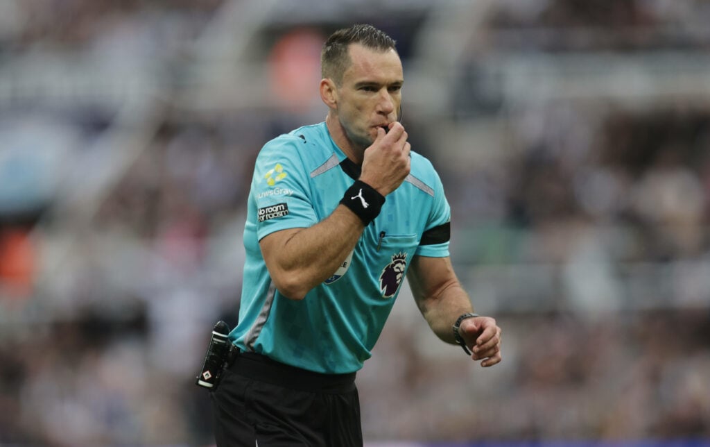 Referee Jarred Gillet officiates the Premier League match between Newcastle United and Arsenal at St. James s Park in Newcastle, United Kingdom, on September 28, 2025