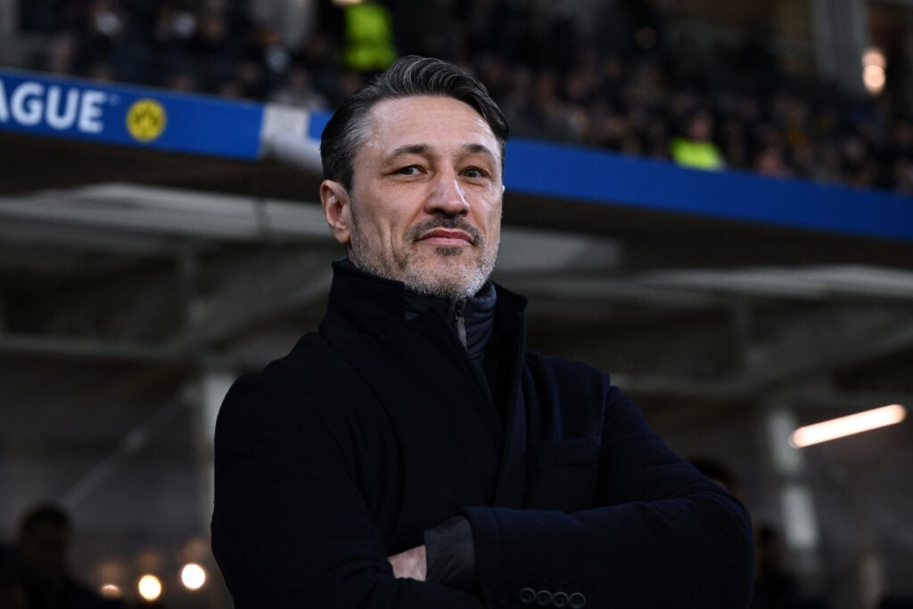Borussia Dortmund manager Niko Kovac stands with his arms folded on the touchline.