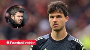 Manchester United goalkeeper Senne Lammens stares towards a circular inset, where manager Michael Carrick watches on.