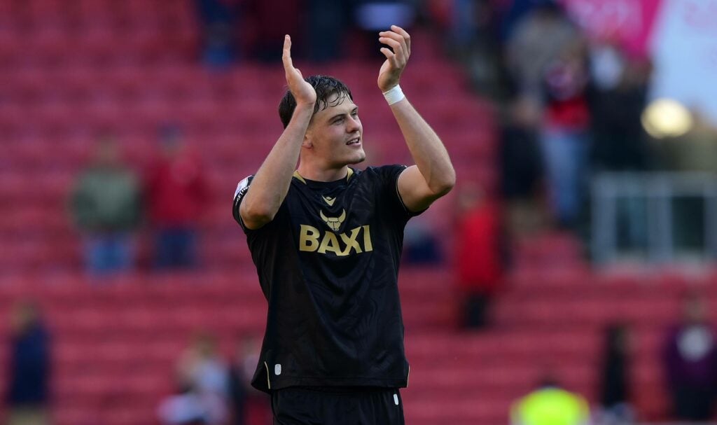 Tottenham loanee Will Lankshear applauds after a game for Oxford United.