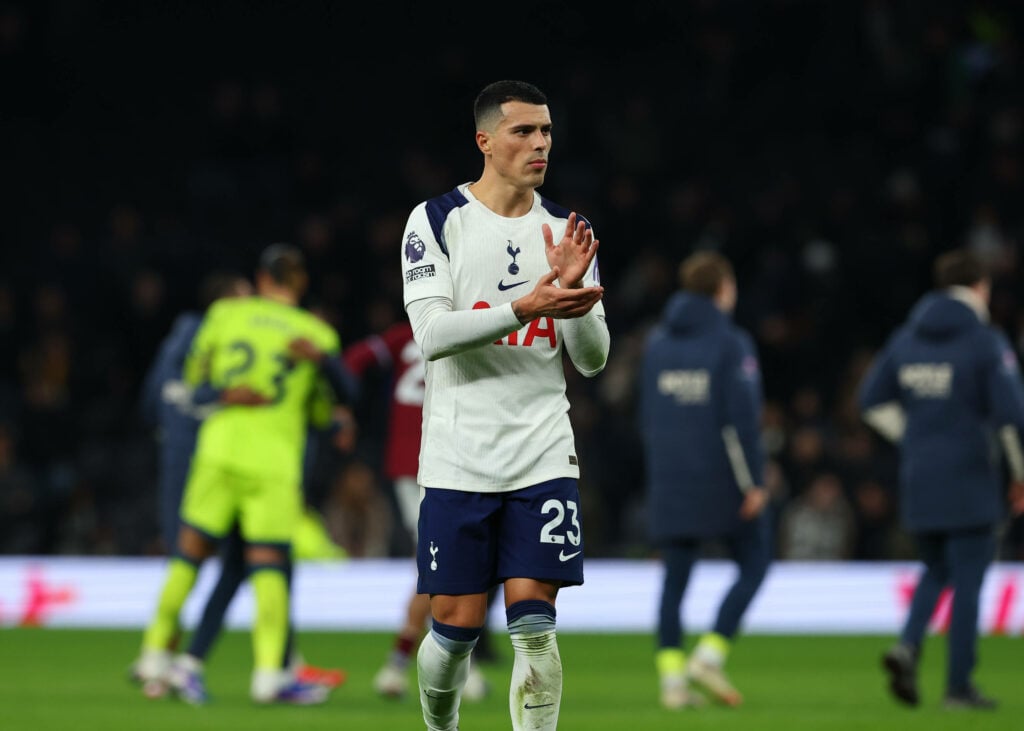 Tottenham defender Pedro Porro applauds the fans after a game.