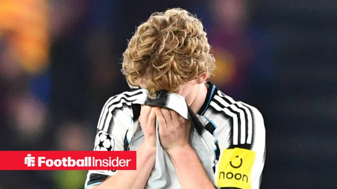 Newcastle United winger Anthony Gordon covers his face with his shirt