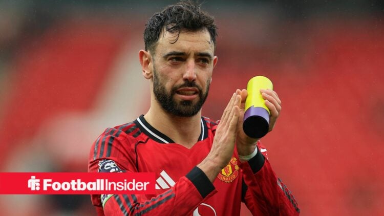 Man United midfielder Bruno Fernandes clapping and holding a player of the match award