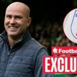 Football Insider exclusive as Motherwell manager Jens Berthel Askou smiles towards the EFL badge, which features in a circular inset.