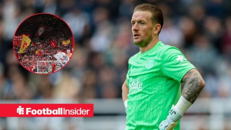 Everton goalkeeper Jordan Pickford has his hands on his hips during a game, as Liverpool fans wave flags in a circular inset.