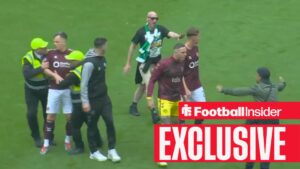 Lawrence Shankland protected by Celtic supporters during Celtic Park pitch invasion on 16 May, 2026