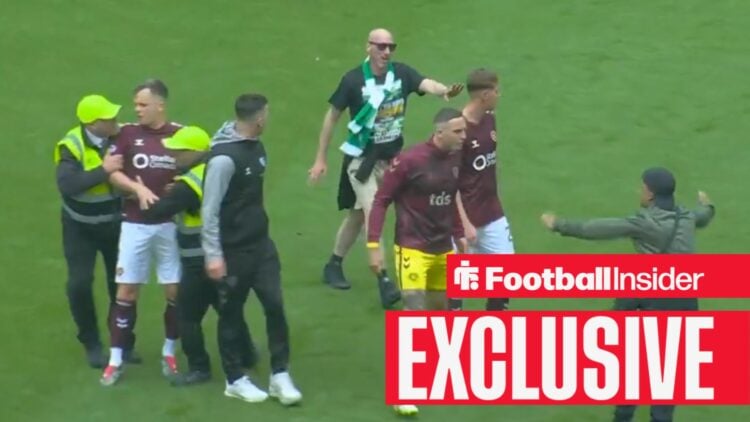Lawrence Shankland protected by Celtic supporters during Celtic Park pitch invasion on 16 May, 2026