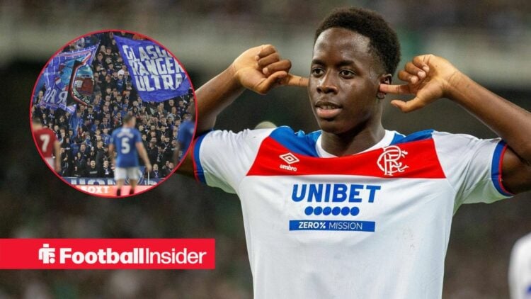 Rangers winger Djeidi Gassama celebrates with his fingers in his ears, as the fans wave flags in a circular inset.